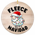 A Fluffy Sheep in a Santa Hat Wrapped Diagonally in Bulb Lights on Natural Woodgrain. Ceramic Keepsake.