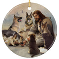 Robed Figure Offering a Hand to a Puppy While Four German Shepherds Gather Around. Ceramic Keepsake.
