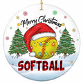 A Neon Yellow Softball in a Santa Hat Wrapped in Lit Bulbs Between Two Pines. Ceramic Keepsake.