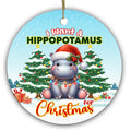 Baby Hippo in an Oversized Santa Hat Draped in Bulb Lights Between Two Trees. Ceramic Keepsake for Kids.
