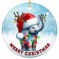A Baby Elephant With Its Trunk Curled Up in a Santa Hat and Baubled Antlers. Ceramic Keepsake for Animal Lovers.