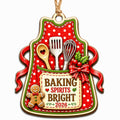 Shows a Polka Dot Apron with Baking Tools and a Baking Spirits Bright 2026 Tag. Gift for Home Bakers.