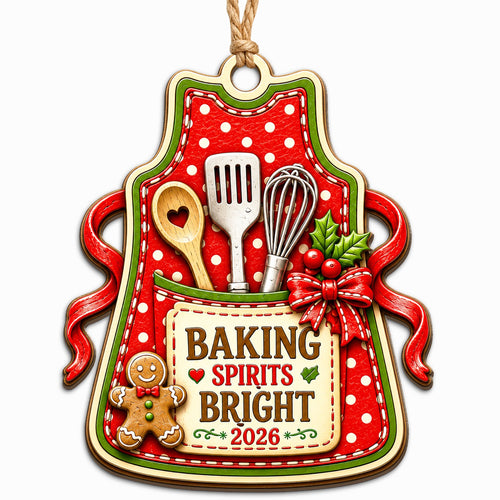 Shows a Polka Dot Apron with Baking Tools and a Baking Spirits Bright 2026 Tag. Gift for Home Bakers.