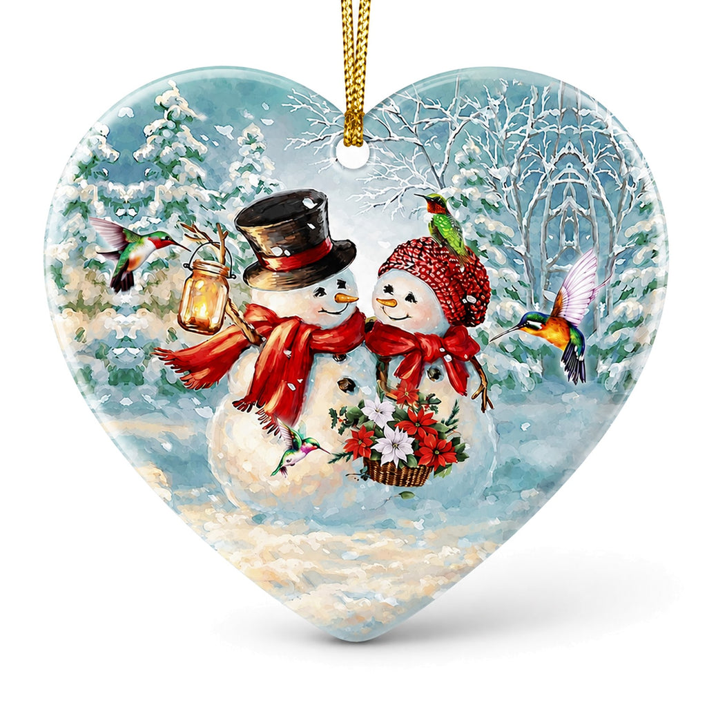 Two Snowmen With a Lantern and Poinsettias Among Iridescent Hummingbirds. Heart-Shaped Ceramic Keepsake.