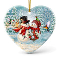 Two Snowmen With a Lantern and Poinsettias Among Iridescent Hummingbirds. Heart-Shaped Ceramic Keepsake.