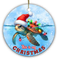 Sea Turtle Gliding Below the Waterline in a Santa Hat and Bulb Lights. Ceramic Keepsake for Ocean Lovers.