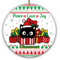 Round-Faced Black Cat in a Santa Hat Popping Out of a Striped Gift Box. Ceramic Keepsake for Cat Lovers.