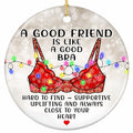 A Nordic Knit Garment Draped in Bulb Lights on a Snowy Bokeh Ground. Cheeky Ceramic Keepsake for Best Friends.