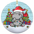 Chubby Hippo in an Oversized Santa Hat Tangled in Lights. Ceramic Keepsake for Kids and Hippo Collectors.