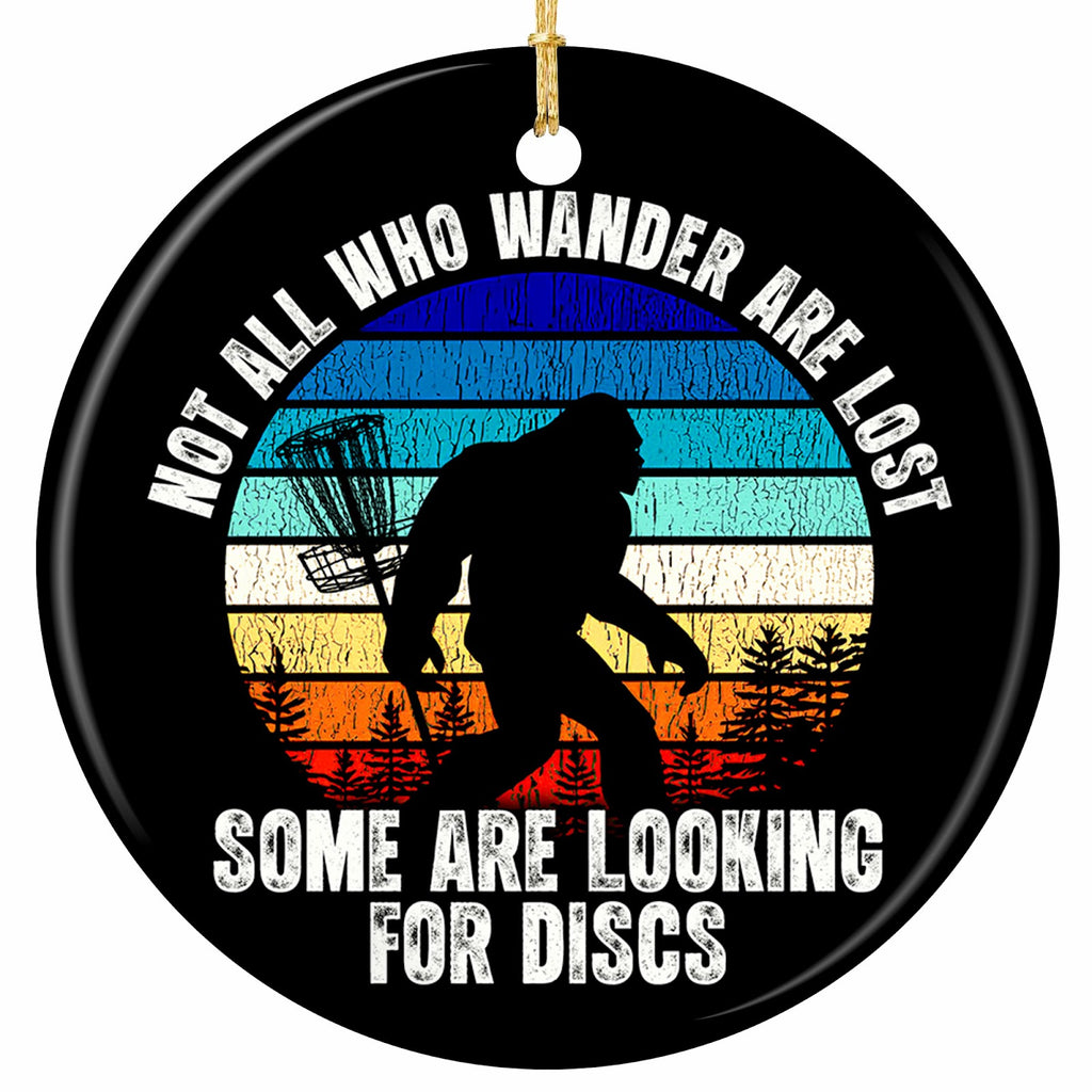 Bigfoot Silhouette Against a Retro Striped Sunset Beside a Chain Basket. Ceramic Keepsake for Disc Golfers.