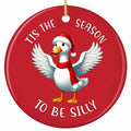 A Wing-Spread Duck in a Santa Hat and Long Fur-Trimmed Scarf on Bright Red. Ceramic Keepsake for Duck Fans.