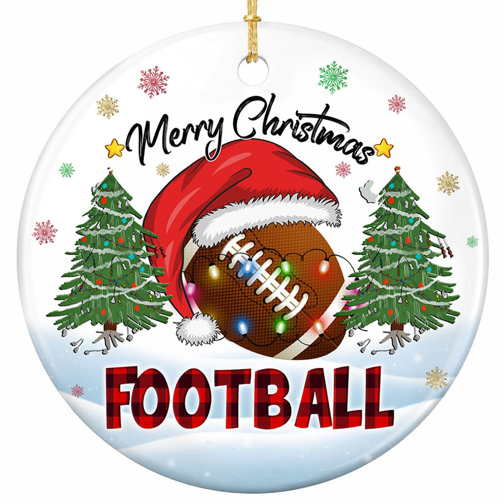 A Brown Football in an Oversized Santa Hat Draped in Bulbs Between Two Lit Pines. Ceramic Keepsake.