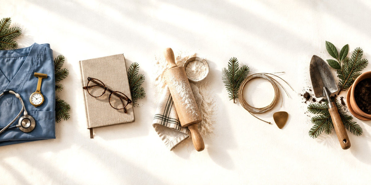 Gift ideas on cream linen: nurse scrubs, reading glasses, a rolling pin, guitar strings and a garden trowel